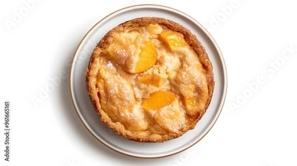 Obraz Freshly baked peach cobbler on white plate - top view of homemade dessert