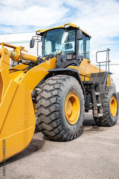 Obraz Yellow tractor at the back. Construction equipment.