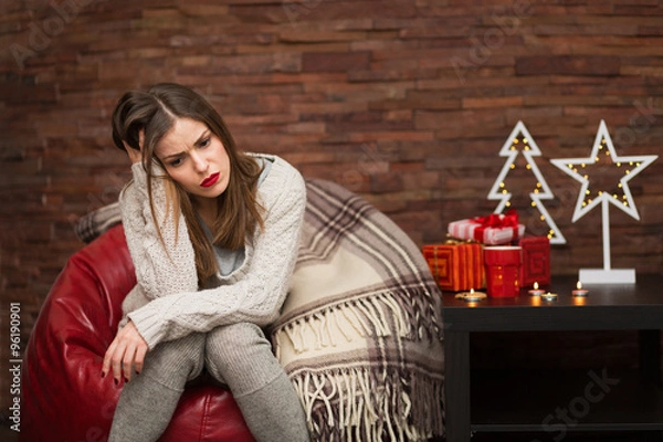 Obraz Sad woman with gift boxes