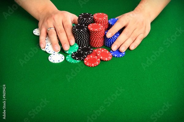 Obraz Player pushing chips into the pot going "all in".