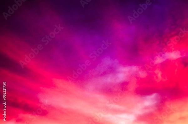 Obraz Red, Purple and Orange clouds at sunrise with the sun low in the frame.