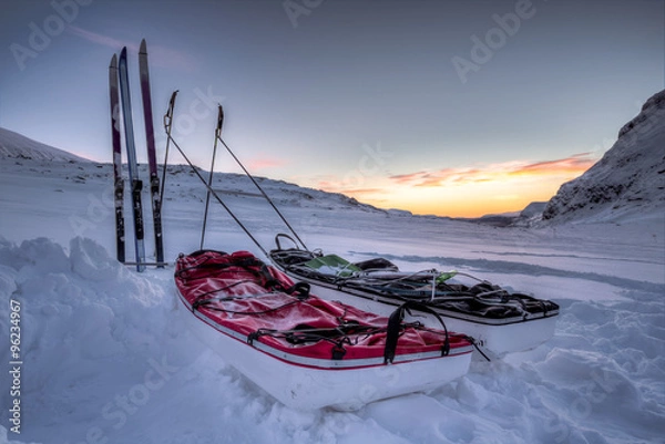 Fototapeta Sunrise on a Winter Expedition with Pulka 