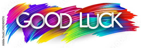 Fototapeta Good luck paper word sign with colorful spectrum paint brush strokes over white. Vector illustration.