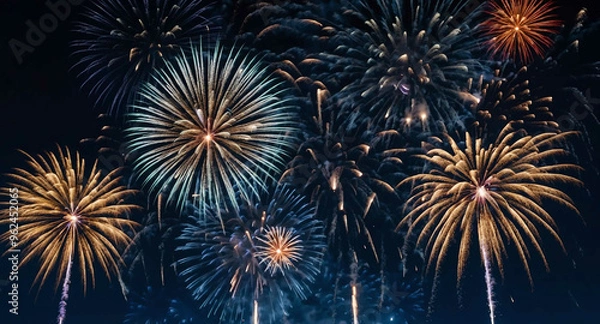 Fototapeta Midnight blue sky with shimmering fireworks background