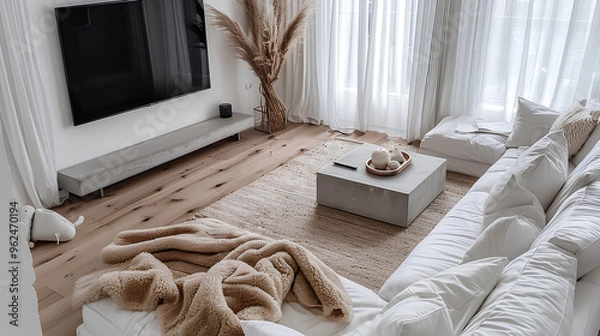 Obraz White living room with TV on the wall and coffee table, sofa in front of the television, home interior design