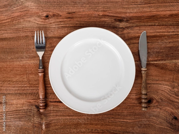 Obraz Empty plate rustic fork and knife on wooden table