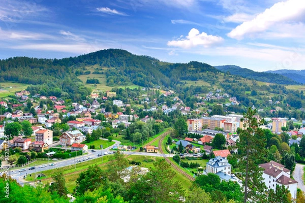 Obraz View at the town and nearest mountains from the ruins of a medieval castle in Muszyna, Poland