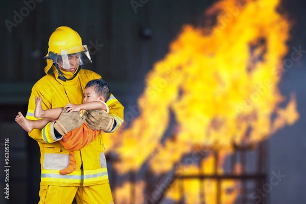 Fototapeta firefighter, fireman rescued the child from the fire