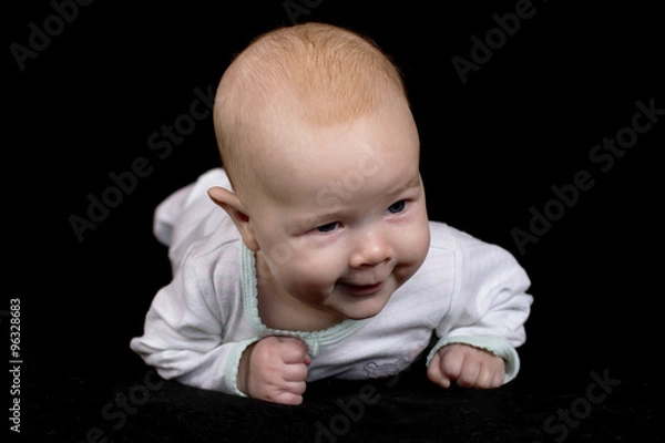Obraz infant isolated on a black background