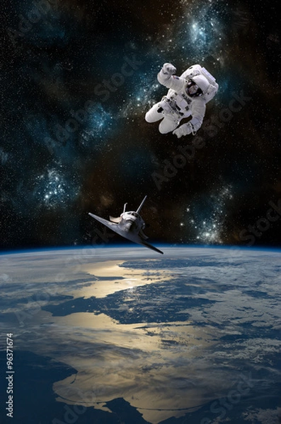 Fototapeta An astronaut drifting in space is rescued by a space shuttle - Elements of this Image Furnished by NASA.