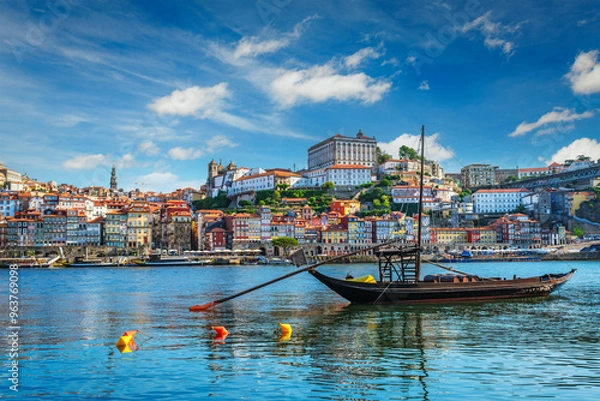 Fototapeta View of Porto city and Douro river with traditional boats with port wine barrels ship from famous tourist viewpoint Marginal de Gaia riverfront. Porto, Vila Nova de Gaia, Portugal