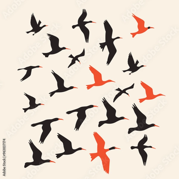 Fototapeta Silhouettes of birds flying with a few highlighted in orange on a cream background.