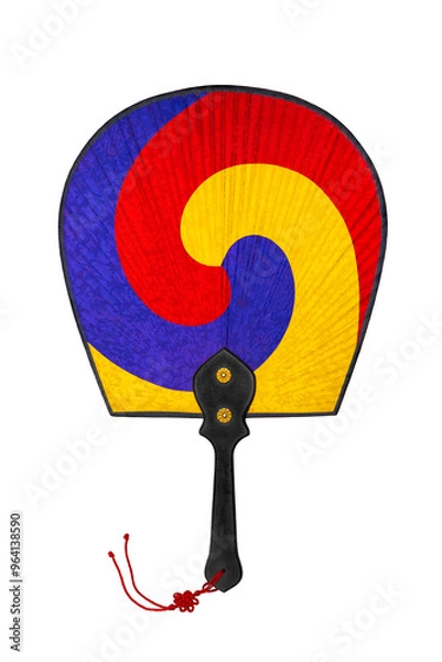 Fototapeta Korean traditional fan with wooden handle and silk fabric in three colors - red, yellow and blue isolated on white background. Buddhist Yin-Yang symbol