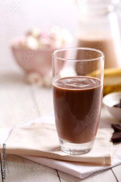 Obraz Glass of chocolate milk on table close-up