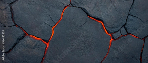 Obraz A close-up of a cracked, volcanic rock surface with glowing lava beneath. The cracks in the rock form intricate patterns against the dark, textured background. Generative AI