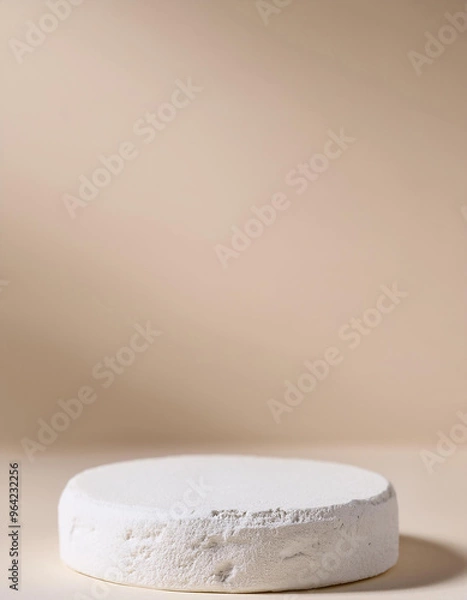 Fototapeta Empty round podium for product presentation, minimal pedestal. Light beige backdrop.