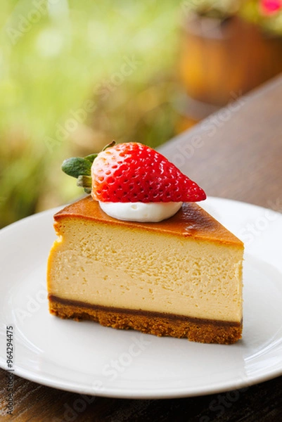 Fototapeta Cheesecake with strawberry on the top