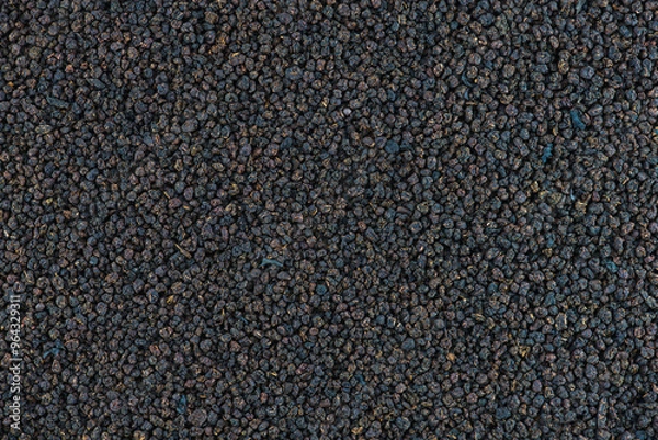 Fototapeta Black tea granulated texture. Indian black tea granules assam texture or background, close-up, high resolution.