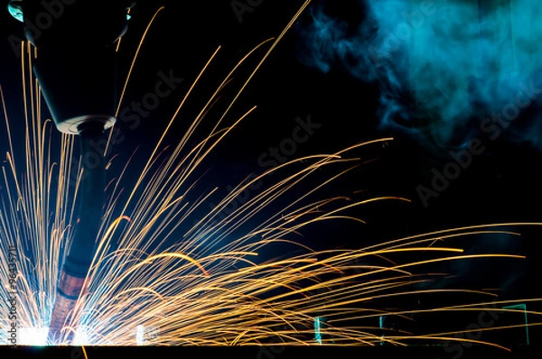 Obraz  Welding robots movement in a car factory