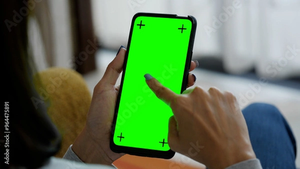 Fototapeta phone with finger touching the screen, smartphone green screen	
