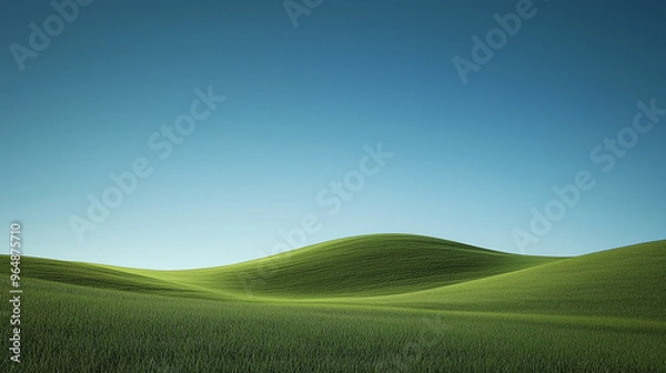 Fototapeta Serene sloping hill with smooth green grass under a clear blue sky, creating a minimalist, peaceful landscape.