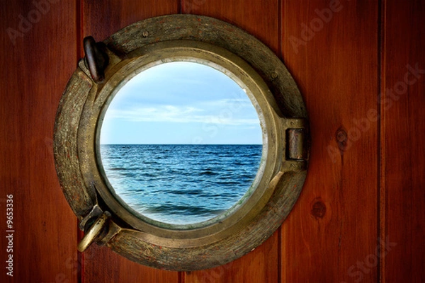 Fototapeta Close-up of a boat closed porthole with ocean view