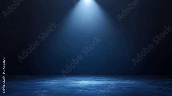 Fototapeta Rich navy background with a single spotlight casting a cool bluish glow from above, leaving ample space for branding or minimalist designs.