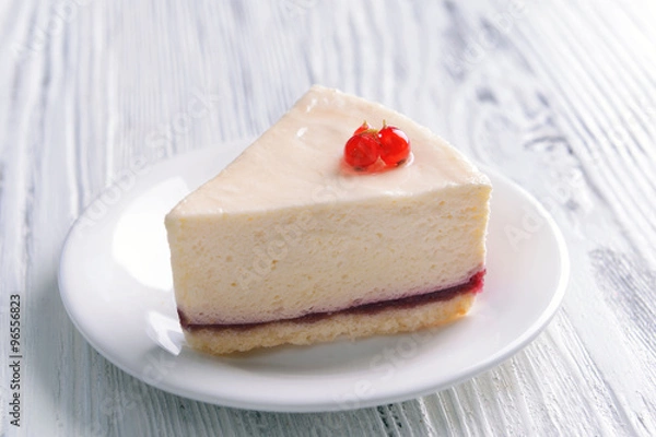 Fototapeta Delicious cheesecake with berries on table close up