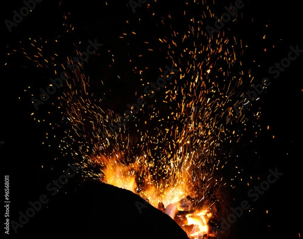 Fototapeta The flame sparks from a forge