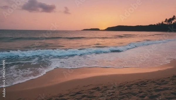 Obraz Soft Blue Waves on a Sandy Beach at Sunset