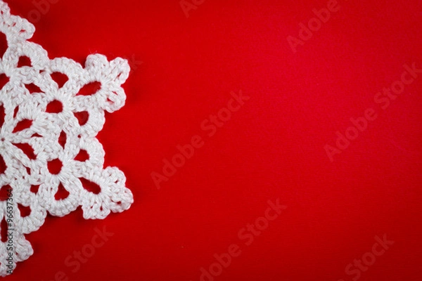 Obraz snowflakes crocheted from white thread on a red background