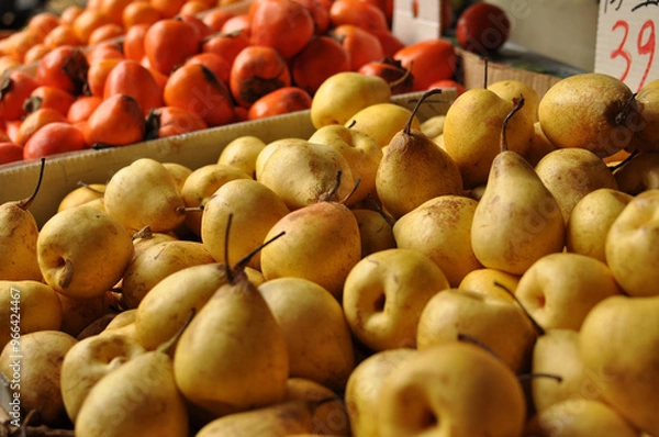 Obraz pears and persimmons at outdoor market