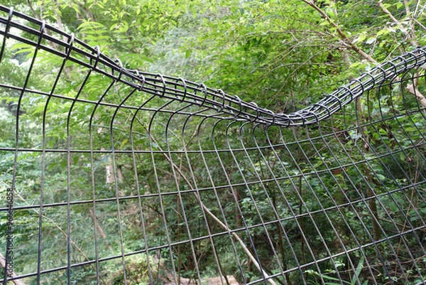 Fototapeta ひしゃげたフェンス