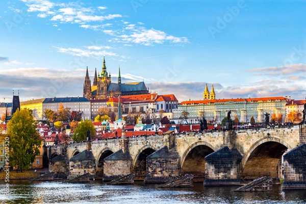 Fototapeta Sunset view of Charles Bridge(Karluv most), Prague Castle (Prazsky hrad) and Vltava river in Prague. Chech Republic