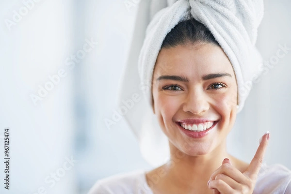 Obraz Beauty, moisturizer and portrait of excited woman in bathroom of home for morning skincare routine. Cream, face and finger with happy person in towel at apartment for cosmetics or dermatology