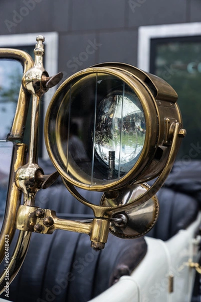 Fototapeta Golden headlight of an old retro car of 1920s