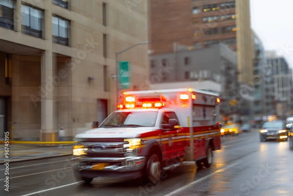 Fototapeta A blurred ambulance races through the bustling streets of New York City, a beacon of hope and help in times of need.