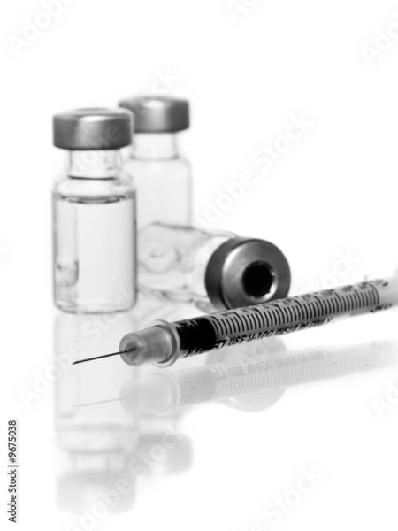 Fototapeta three vials with hypodermic needle