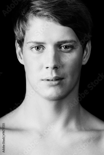 Fototapeta Black and white image of pretty young adult male teenager.