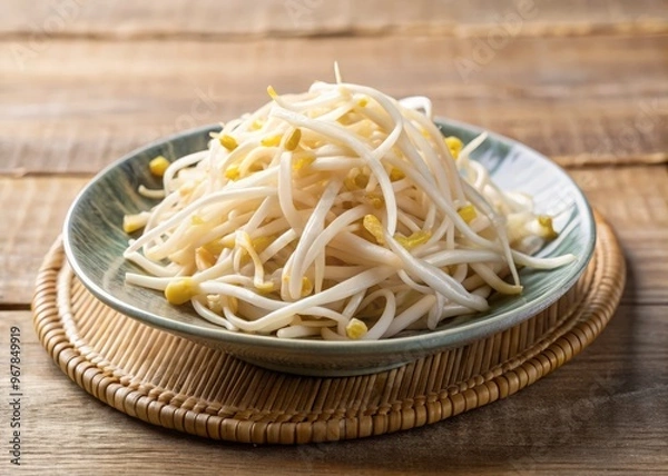 Fototapeta Freshly steamed bean sprouts, glistening with moisture, arranged artfully on a small, creamy ceramic plate, captured with a shallow depth of field to emphasize the tender, crunchy texture.