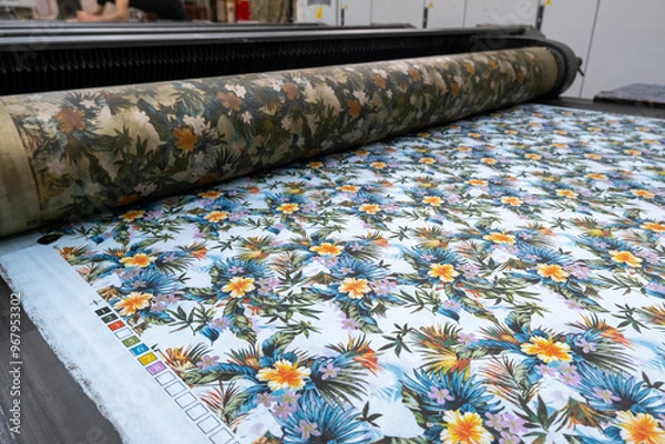 Fototapeta Fabric printing machine in a textile factory in close up view.