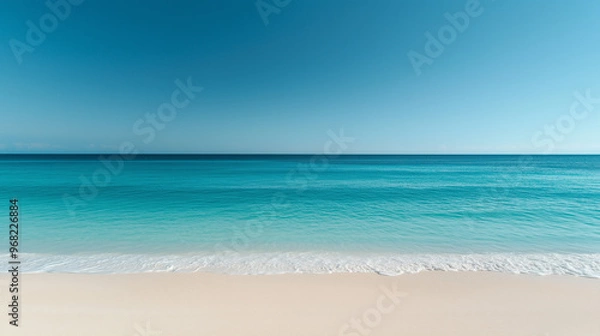 Fototapeta Serene beach with smooth white sand, calm ocean waves, and a seamless gradient sky in vibrant blue tones, capturing the beauty of tranquility and isolation