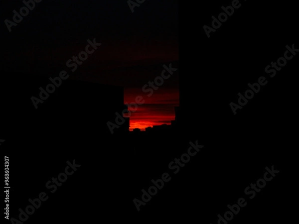 Obraz red sky sunset over the dark city