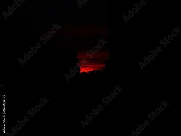Obraz red sky sunset over the dark city