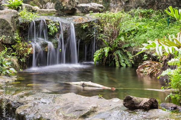 Fototapeta Natural river flowing like a small waterfall.
