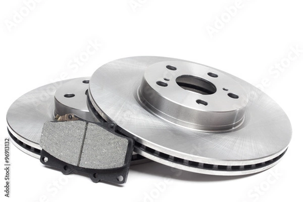 Fototapeta brake discs and brake pads on a white background. car parts