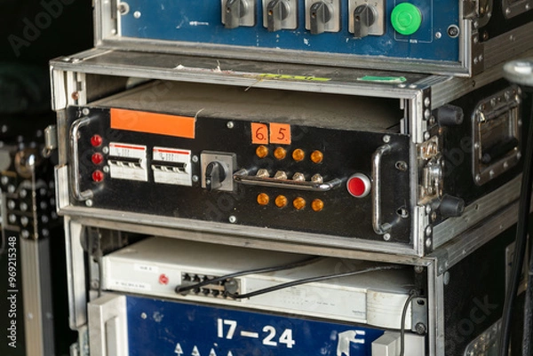 Fototapeta Industrial stage light and sound control equipment on the backstage of a concert, essential for managing audio and visual effects during performances