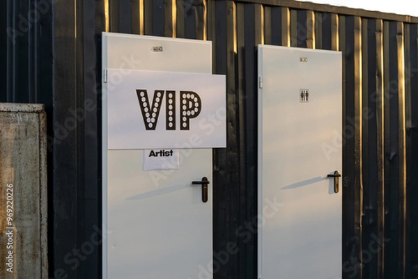 Fototapeta Portable toilet for artists placed on the backstage of a concert to provide convenience during live events and performances