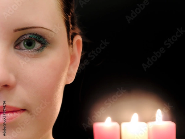 Fototapeta half woman face with the three candles