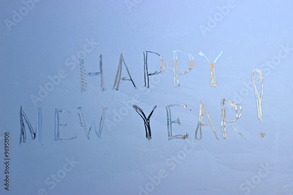 Fototapeta  written on frosty winter window background